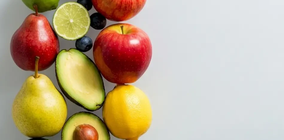 A vibrant, high-quality image of mixed fresh produce like blueberries, avocados, apples, pears, lemons, and limes cascading down.